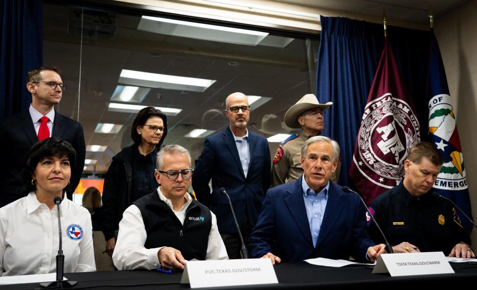 Gov. Greg Abbott, second from right, held a news conference Friday about the state's preparations for the arctic blast. He was joined by Railroad Commission Chairwoman Christi Craddick, left, ERCOT head Pablo Vegas, second from left, and Texas Division of Emergency Management Chief Nim Kidd, right.