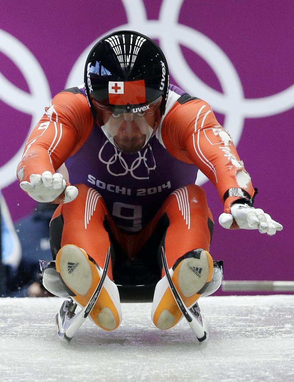 Bruno Banani of Tonga starts a run during a training session for the men's singles luge at the 2014 Winter Olympics, Thursday, Feb. 6, 2014, in Krasnaya Polyana, Russia. (AP Photo/Dita Alangkara)
