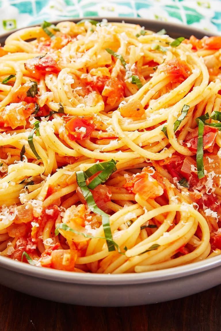 <p>When it comes to <a href="https://www.delish.com/uk/pasta-recipes/" rel="nofollow noopener" target="_blank" data-ylk="slk:pasta;elm:context_link;itc:0;sec:content-canvas" class="link ">pasta</a> we want something simple and fast. Pasta Pomodoro is a step above from <a href="https://www.delish.com/uk/cooking/recipes/a28868982/best-spaghetti-and-meatballs-recipe/" rel="nofollow noopener" target="_blank" data-ylk="slk:Spaghetti and Meatballs;elm:context_link;itc:0;sec:content-canvas" class="link ">Spaghetti and Meatballs</a> and highlights the freshness of tomatoes — pomodoro means 'tomato' in Italian. You're cooking down the tomatoes just enough to form a light sauce but keeping most of them intact. It's the freshest pasta and is best enjoyed outside with a mound of grated Parmesan. </p><p>Get the <a href="https://www.delish.com/uk/cooking/recipes/a32000915/pasta-pomodoro-recipe/" rel="nofollow noopener" target="_blank" data-ylk="slk:Pasta Pomodoro;elm:context_link;itc:0;sec:content-canvas" class="link ">Pasta Pomodoro</a> recipe.</p>