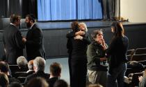 NEWTOWN, CT - DECEMBER 16: Mourners comfort one another before U.S. President Barack Obama speaks at an interfaith vigil for the shooting victims from Sandy Hook Elementary School on December 16, 2012 at Newtown High School in Newtown, Connecticut. Twenty-six people were shot dead, including twenty children, after a gunman identified as Adam Lanza opened fire at Sandy Hook Elementary School. Lanza also reportedly had committed suicide at the scene. A 28th person, believed to be Nancy Lanza, found dead in a house in town, was also believed to have been shot by Adam Lanza. (Photo by Olivier Douliery-Pool/Getty Images)