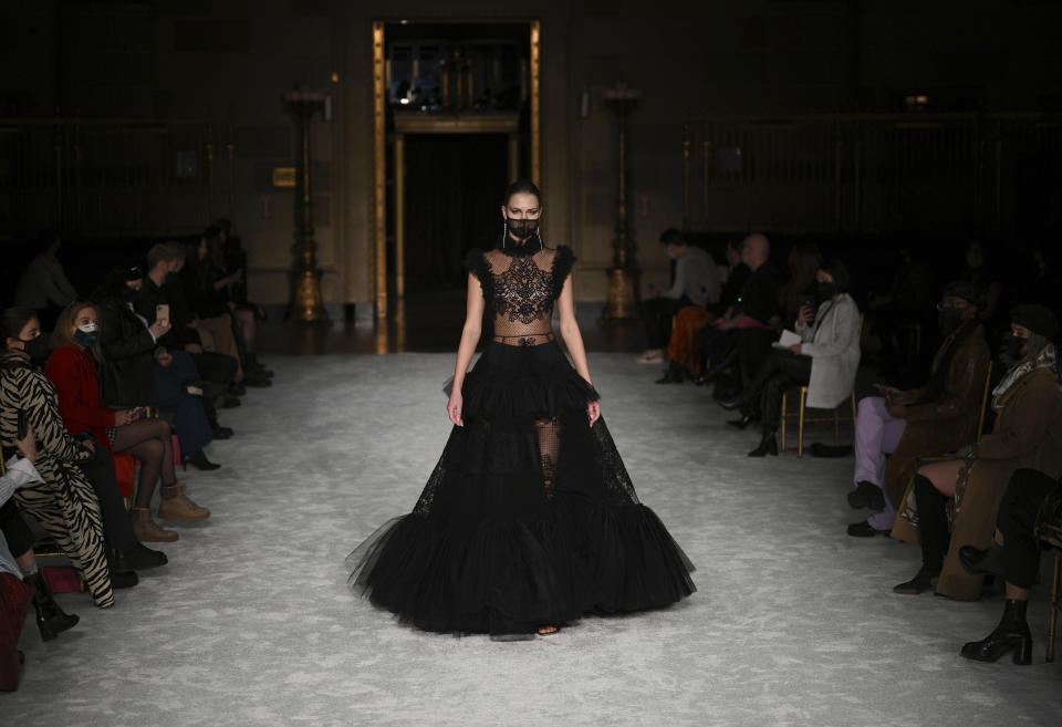 A model walks the runway at the Christian Siriano Fall/Winter 2021 at Gotham Hall during New York Fashion Week on Thursday, Feb. 25, 2021, in New York. (Photo by Evan Agostini/Invision/AP)