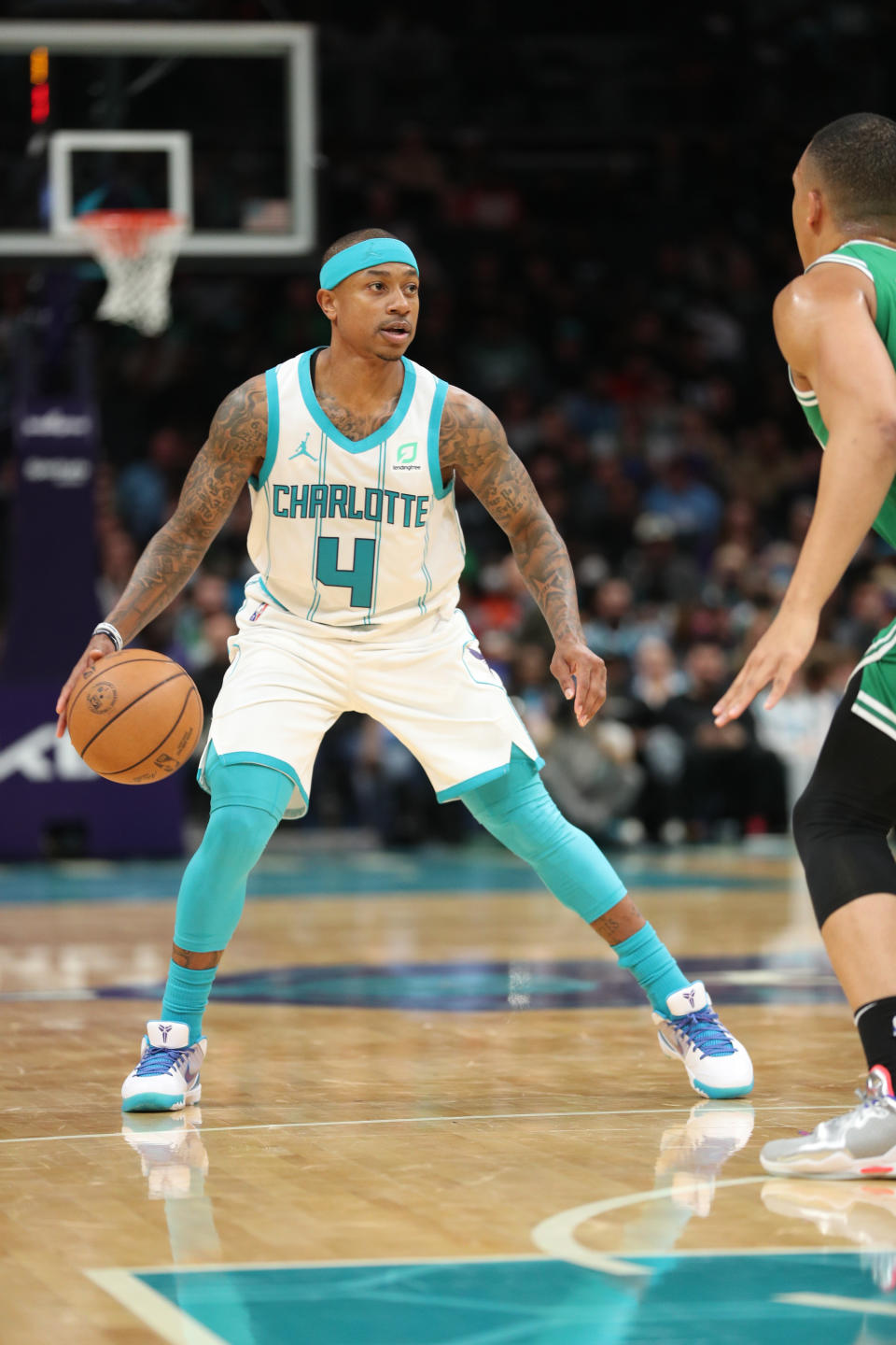 Isaiah Thomas prepares to cross-over a defensive player on the basketball court.