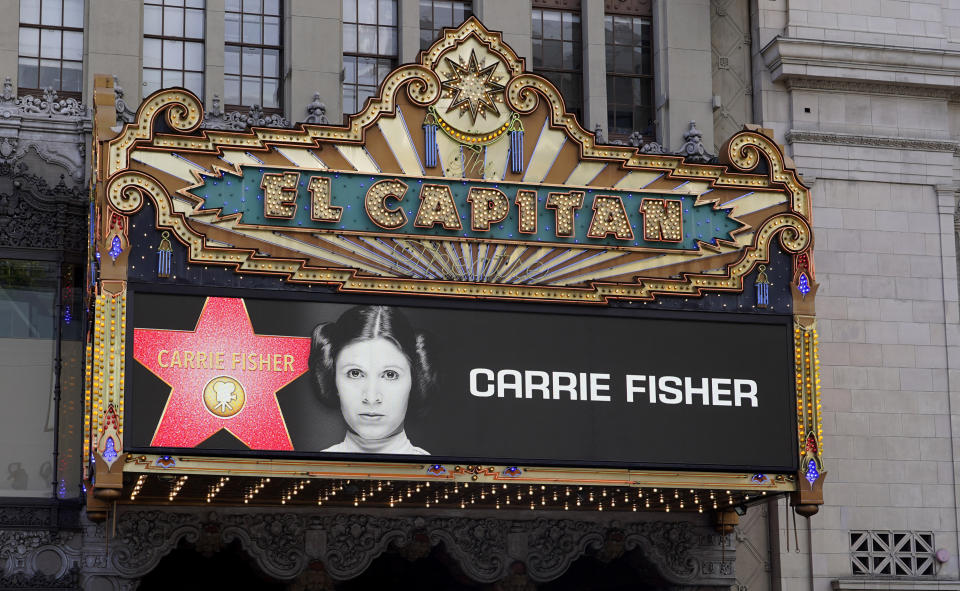 The marquee at the El Capitan theater shows an image of the late actress Carrie Fisher in honor of her posthumous star on the Hollywood Walk of Fame on Thursday, May 4, 2023, in Los Angeles. Fisher is best known for her role as Princess Leia in the "Star Wars" films. (AP Photo/Chris Pizzello)
