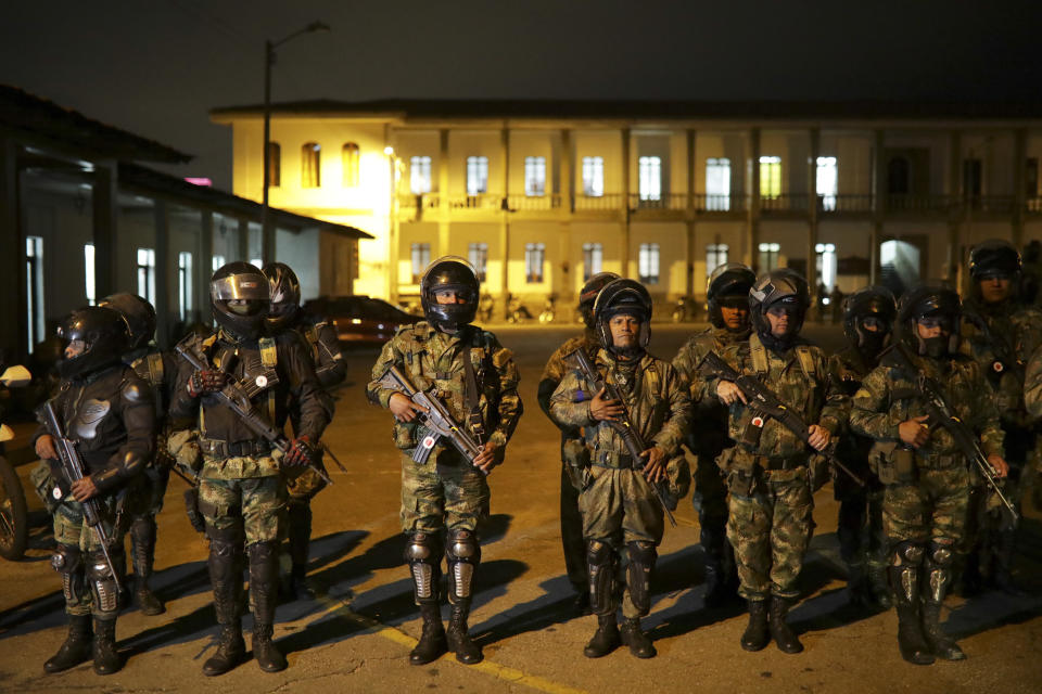 Soldiers line up before leaving to patrol the streets in Bogota, Colombia, Saturday, Nov. 23, 2019. Authorities in Colombia are maintaining a heightened police and military presence in the nation's capital following two days of unrest. (AP Photo/Ivan Valencia)