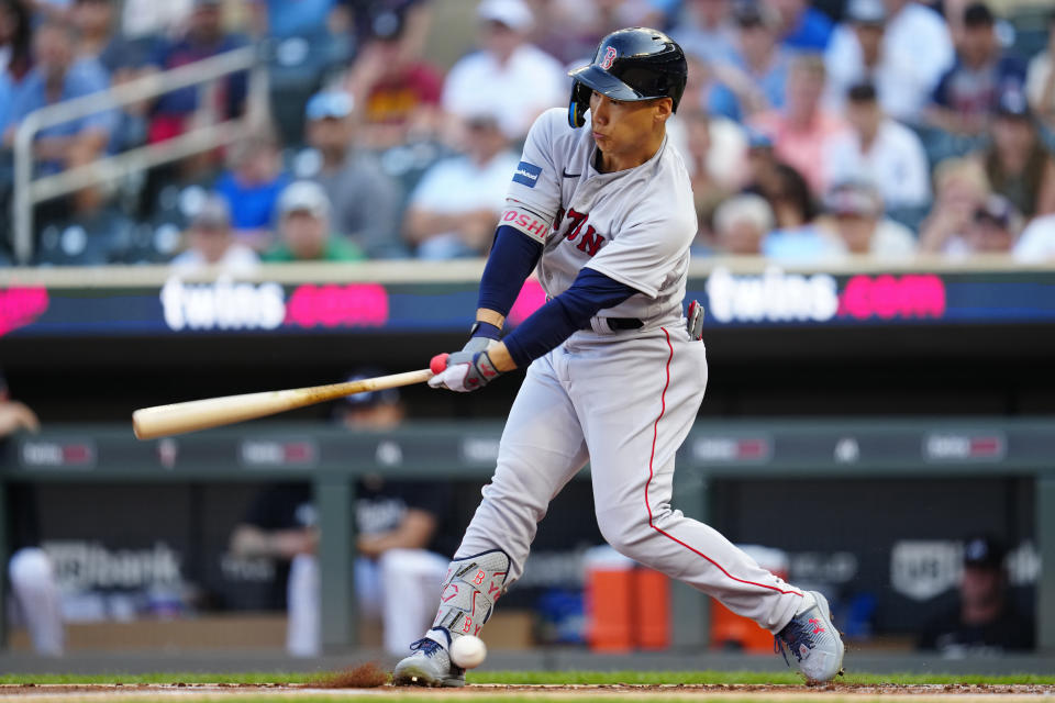 Boston Red Sox's Masataka Yoshida strikes out during the first inning of the team's baseball game against the Minnesota Twins, Tuesday, June 20, 2023, in Minneapolis. (AP Photo/Abbie Parr)