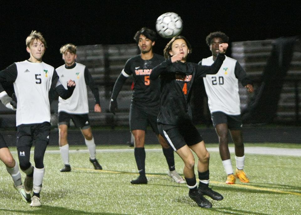 Gardner's Trevor Boudreau (4) reacts to the ball in front of teammate Elvis Camejo (5) and Taconic's Riley Crawford, far left, and Caleb Peprah (20) during a Division 5 state tournament game at Watkins Field in Gardner on Nov. 9.