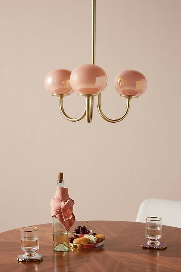 Get it at <a href="https://www.anthropologie.com/shop/pearl-led-chandelier?category=Lighting&amp;color=067" target="_blank" rel="noopener noreferrer">Anthropologie</a>, $498.&nbsp;