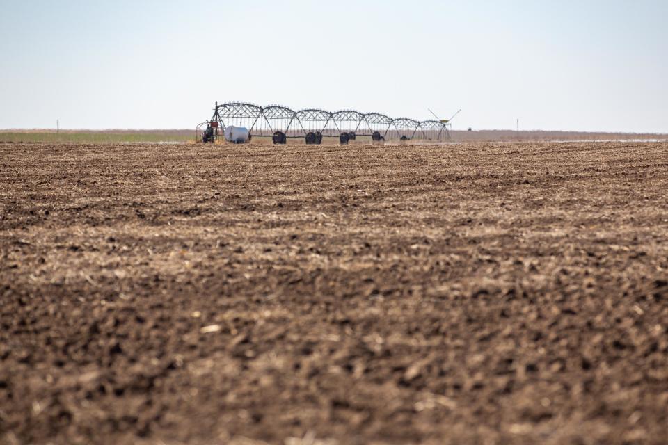 Irrigation sprinklers attach to a water pump in Ford County.