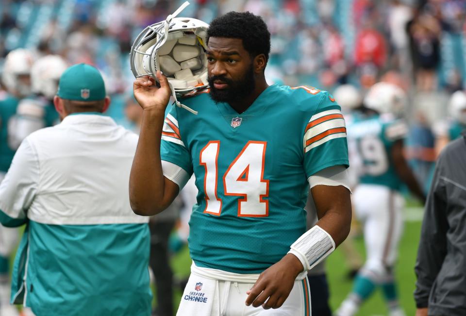 Miami Dolphins quarterback Jacoby Brissett (14) walks off the field after warm ups before the game against the New England Patriots at Hard Rock Stadium in Miami Gardens, Jan. 9, 2022. 