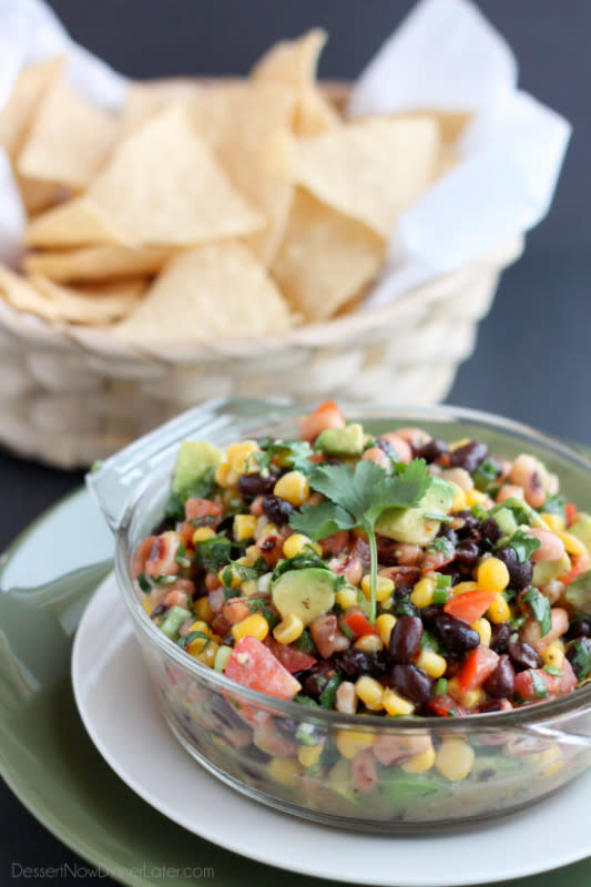 <p>Dessert Now Dinner Later</p><p>Cowboy Caviar is a chunky salsa-type dip with beans, avocado, tomatoes, corn and a zesty dressing. Great for picnics, potlucks, parties or a game-day snack!</p><p><a href="https://www.dessertnowdinnerlater.com/cowboy-caviar/" rel="nofollow noopener" target="_blank" data-ylk="slk:Get the Recipe;elm:context_link;itc:0;sec:content-canvas" class="link ">Get the Recipe</a></p>