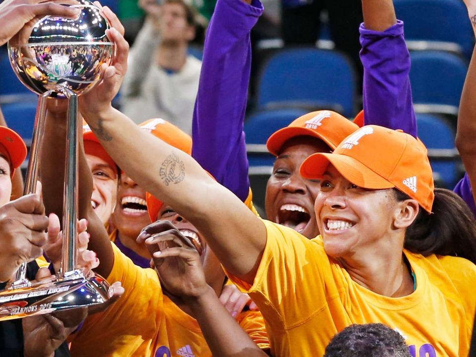 Candace Parker (right) celebrates her first WNBA championship with the Los Angeles Sparks.