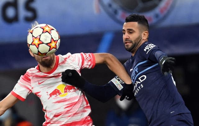 Riyad Mahrez battles for the ball