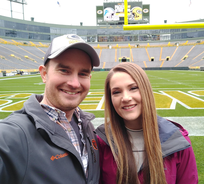 Nick Lilja and girlfriend Morgan Barry attend a Green Bay Packers game at Lambeau Field.