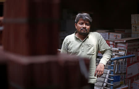 FILE PHOTO: Aas Mohammed poses for a picture inside his shop in Siyana town in the northern state of Uttar Pradesh, India May 15, 2019. REUTERS/Adnan Abidi