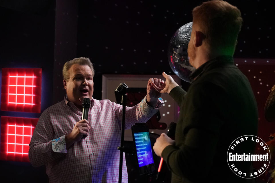 Cam (Eric Stonestreet) and Mitchell get in tune