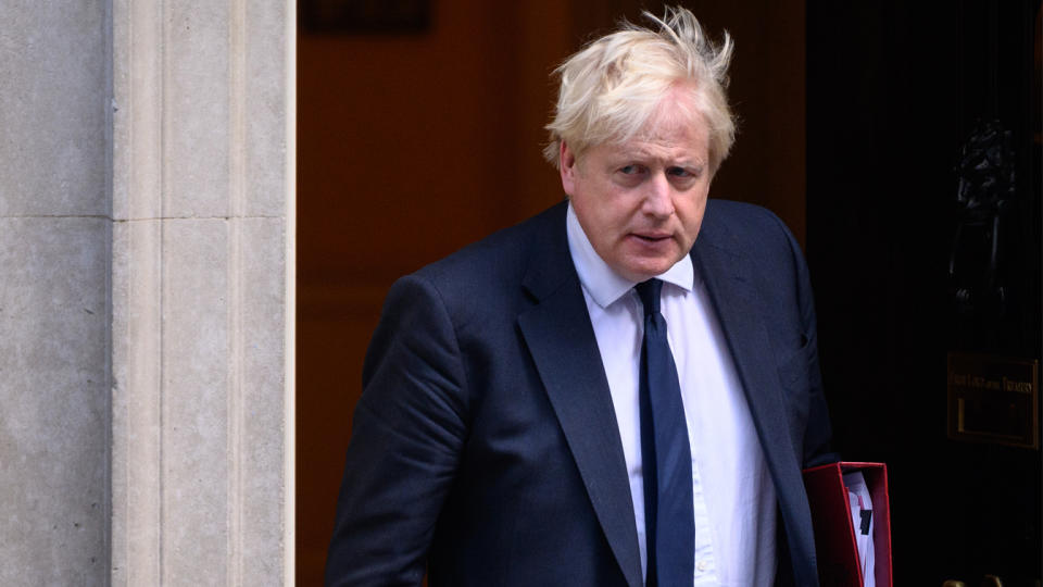 UK Prime Minister Boris Johnson leaves 10 Downing Street as he heads to the weekly PMQ session in the House of Commons on Wednesday in London.