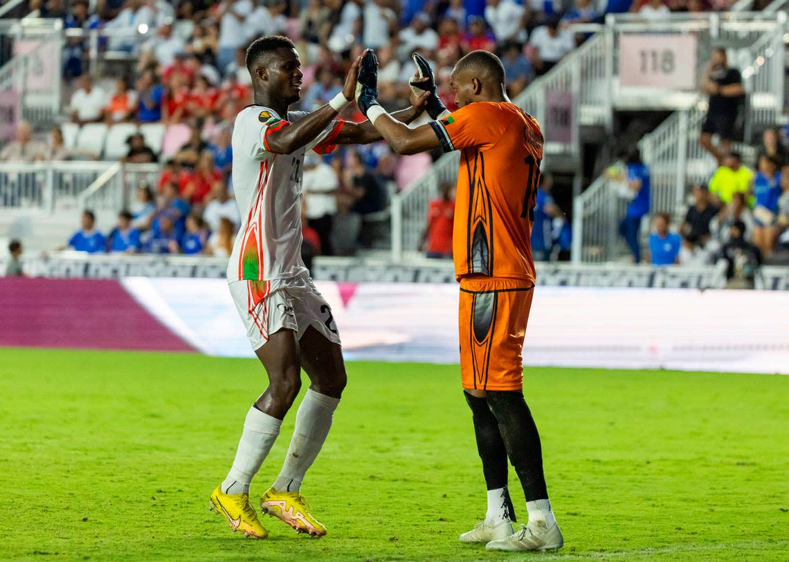Martinique goalkeeper Yannis Clementia (16) and defender Florent Poulolo (22) celebrate after they defeated El Salvador 2 to 1 in their CONCACAF Gold Cup 2023 match at DRV PNK Stadium on Monday, June 26, 2023, in Fort Lauderdale, Fla.