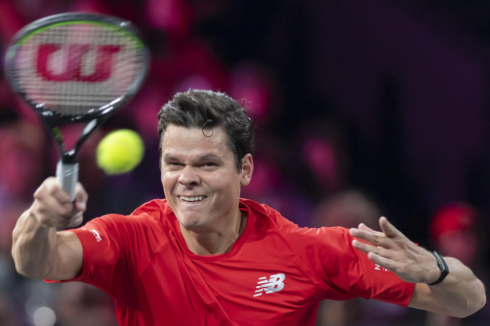 Team world's Milos Raonic returns a ball to Team Europe's Rafael Nadal during their singles match at the Laver Cup tennis event, in Geneva, Switzerland, Saturday, Sept. 21, 2019. (Martial Trezzini/Keystone via AP)