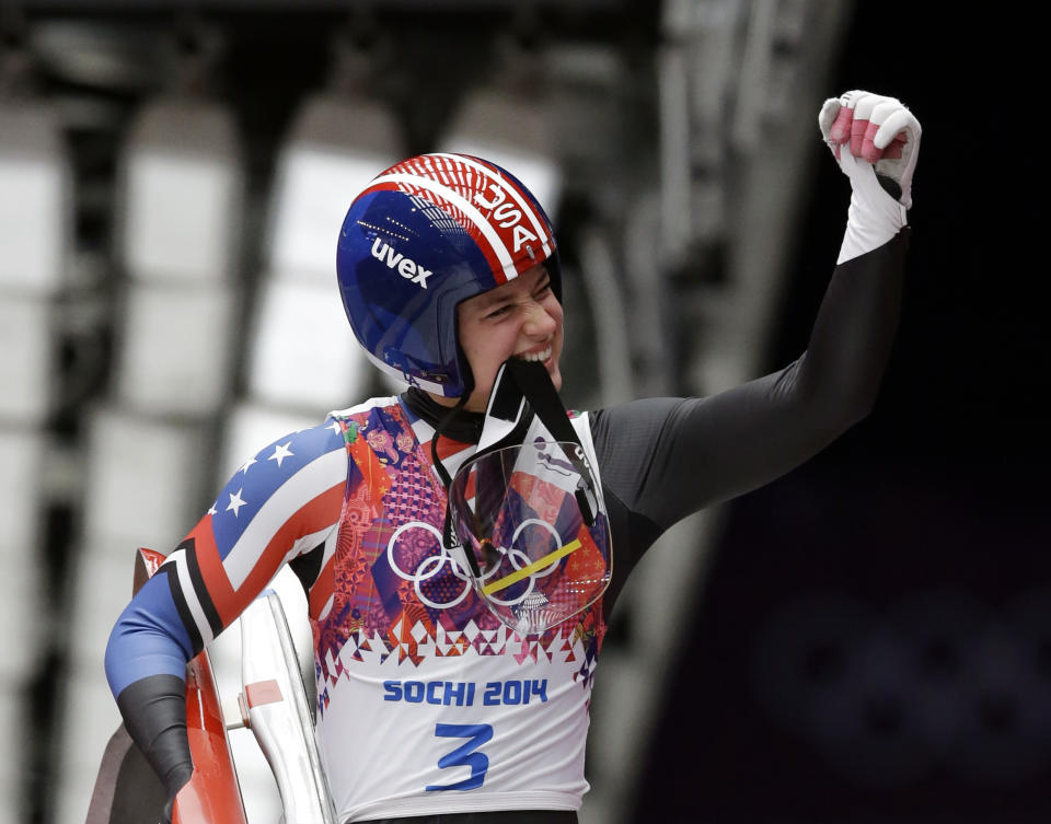 Kate Hansen of the United States waves to supporters after finishing her first run during the women's singles luge competition at the 2014 Winter Olympics, Monday, Feb. 10, 2014, in Krasnaya Polyana, Russia. (AP Photo/Dita Alangkara)
