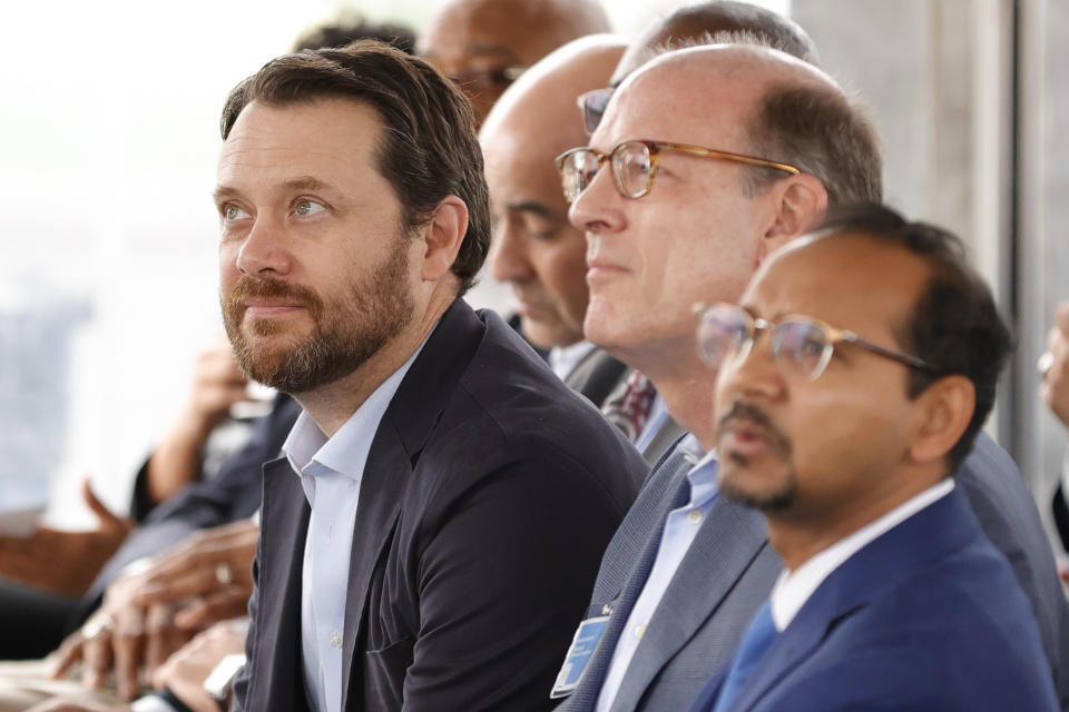 Jason Carter, grandson of former President Jimmy Carter, left, listens during a ceremony honoring President Carter and Jimmy Carter Blvd. on Tuesday, May 23, 2023, in Norcross, Ga. (AP Photo/Alex Slitz)