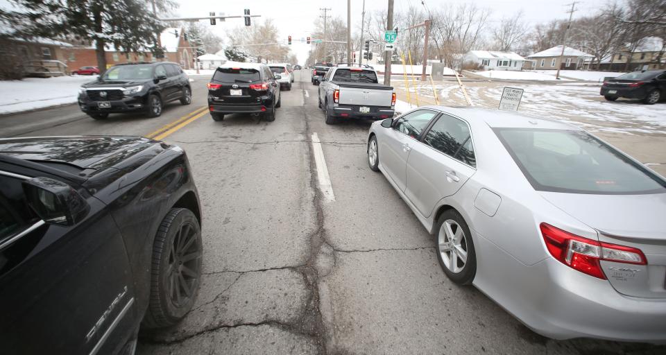 Cars stop at a traffic tight on Grand Avenue at the intersection of 13th Street on Thursday.