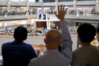 A pro-democracy demonstrator raises his hand up as a symbol of the "Five demands, not one less" during a protest against Beijing's plans to impose national security legislation in Hong Kong