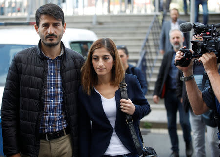 German journalist Mesale Tolu, accompanied by her husband Murat Tolu, arrives at the Justice Palace, the Caglayan courthouse, in Istanbul, Turkey October 16, 2018. REUTERS/Kemal Aslan