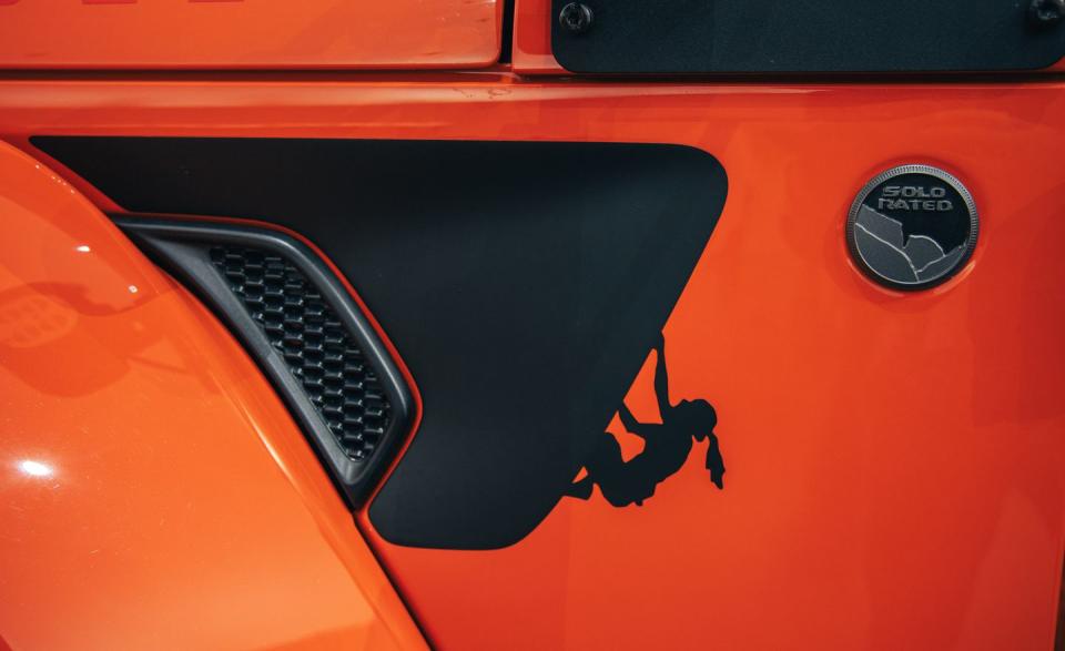 <p>At the side vents there's an image of a climber, uh, climbing, and the rear quarter-panels are adorned with a Jeep Performance Parts logo.</p>