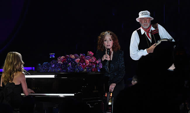 Sheryl Crow, Bonnie Raitt and Mick Fleetwood on stage at the Grammys