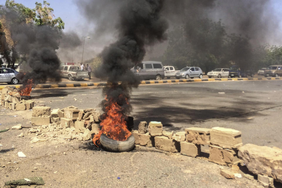 Tires lit by protesters burn near the military headquarters, Sunday, April 7, 2019, in the capital Khartoum, Sudan. Organizers behind anti-government demonstrations in Sudan said Sunday that security forces have killed at least five protesters in the last twenty-four hours. The current wave of unrest erupted in December, initially over price hikes and shortages of food and fuel, but the demonstrations quickly morphed into calls for the overthrow of President Omar al-Bashir. (AP Photo)