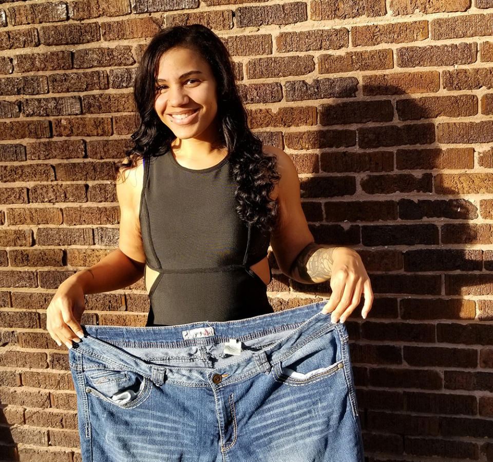 Katie with a pair of her old jeans. (Photo: Courtesy of Katie Bolden)