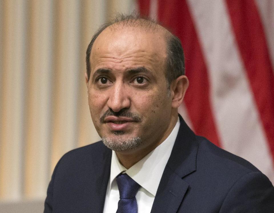 President Ahmad al-Jarba, president of the National Coalition for Syrian Revolutionary and Opposition Forces, speaks at the U.S. Institute of Peace, on Wednesday, May 7, 2014, in Washington. Al-Jarba said that rebel forces need weapons that could “neutralize’’ aerial raids by President Bashar Assad’s air force in order to change the balance of power on the ground and pave the way for a political solution to the crisis. (AP Photo/ Evan Vucci)