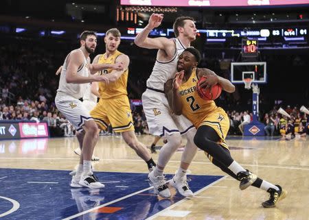 Apr 2, 2019; New York, NY, USA; Wichita State Shockers guard Jamarius Burton (2) collides with Lipscomb center guard Garrison Mathews (24) in the second half of the NIT semifinals at Madison Square Garden. Mandatory Credit: Wendell Cruz-USA TODAY Sports