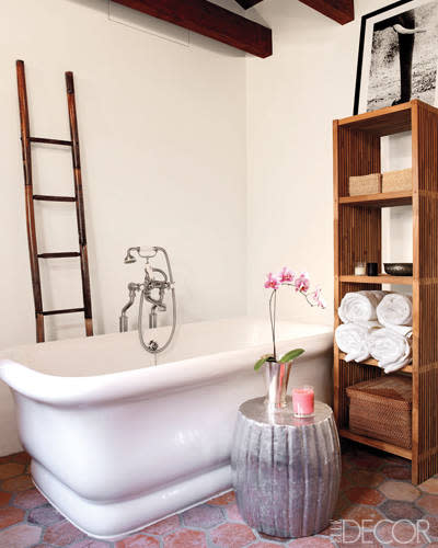 This master bathroom exudes rustic elegance. An antique bamboo ladder adds vertical interest, while a zinc garden stool adds glamour. Click the photo to tour the rest of actress Ellen Pompeo's Hollywood Hills home.