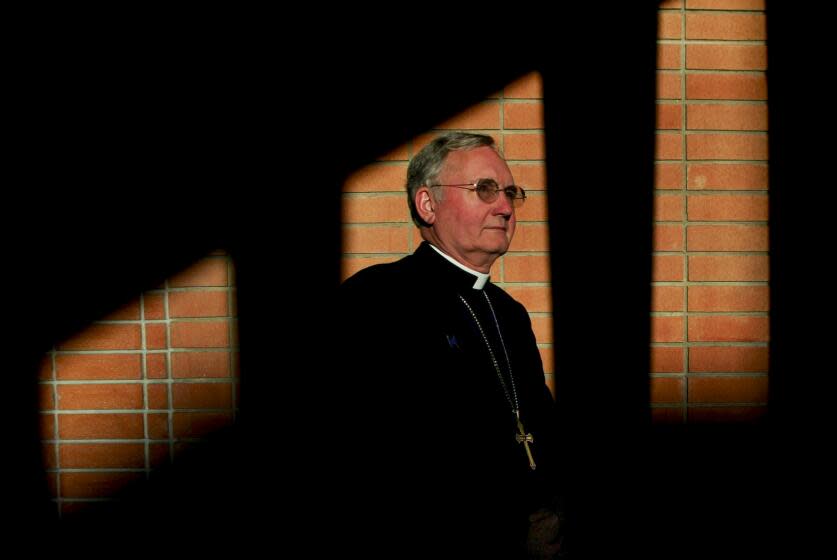 In the Light: Tod D.Brown, Catholic Bishop of Orange County, makes his way down a hallway at the end of the day at the Marywood Center, Friday afternoon in Orange.