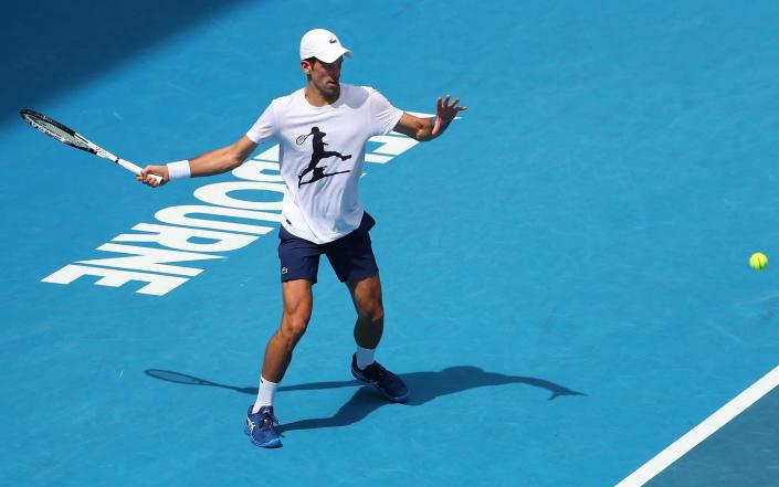 Novak Djokovic practising on court in Melbourne - AFP