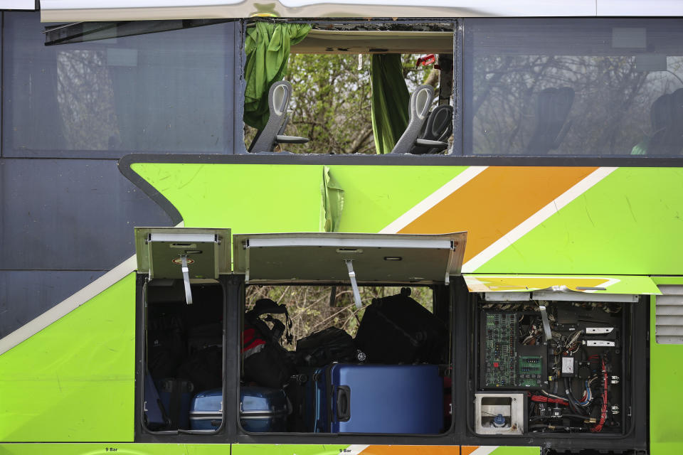 The luggage of the passengers involved in the accident are still on the bus at the scene of the accident on the A9, near Schkeuditz, Germany, Wednesday March 27. 2024. (Jan Woitas/dpa via AP)