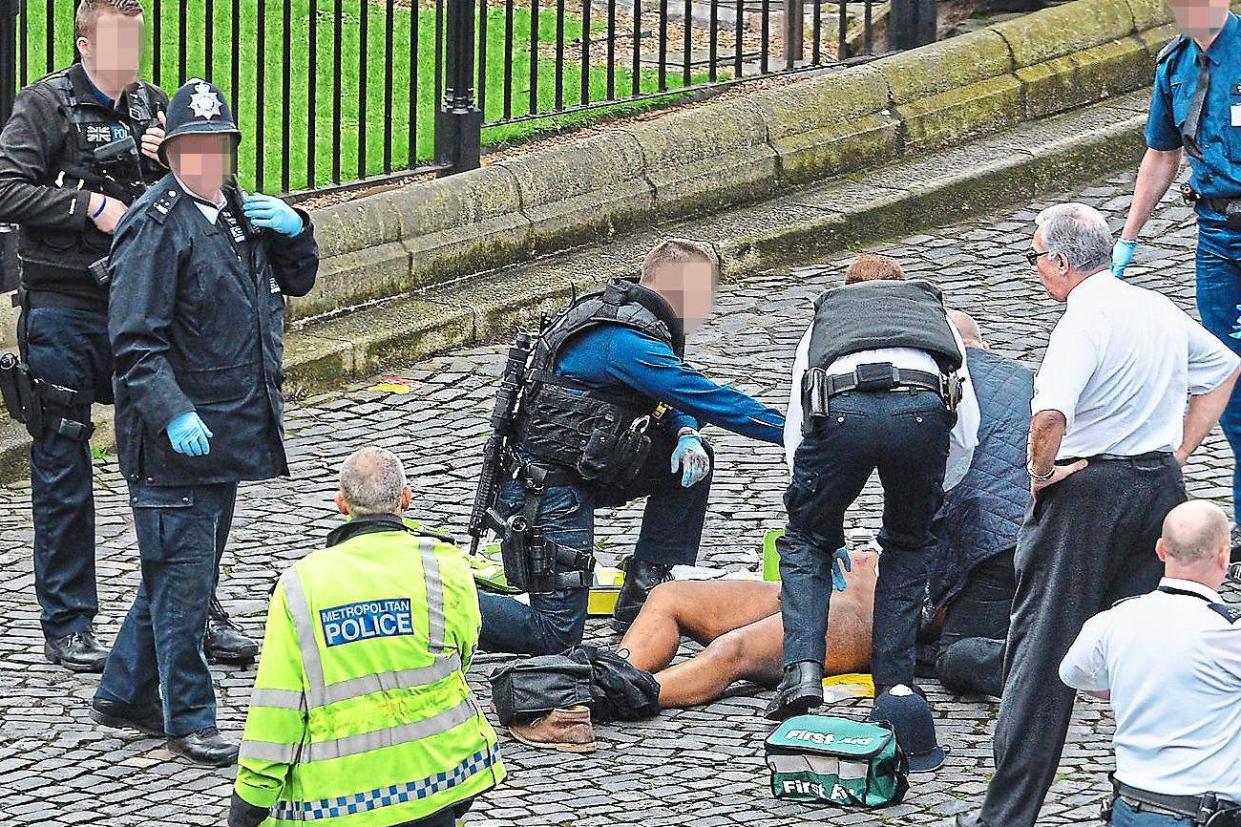 Specialist firearms officers battling to save terrorist Khalid Masood after he stabbed Pc Keith Palmer to death: Stefan Rousseau/PA Wire