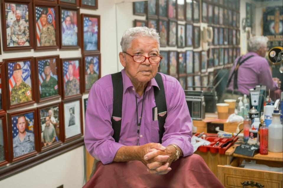 Travis Bell, 18th Airborne Corps barber, poses for a photo in his barbershop June 20, 2024, at Fort Liberty.