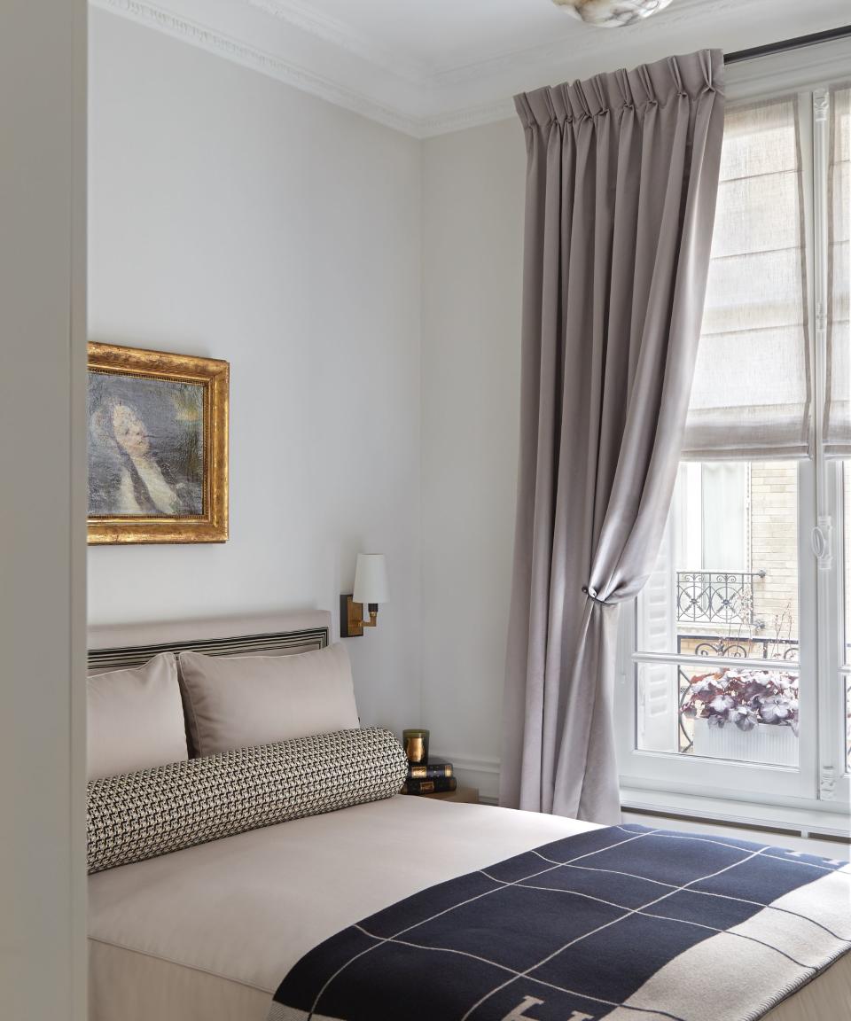 neutral bedroom with cream textures and black contrast