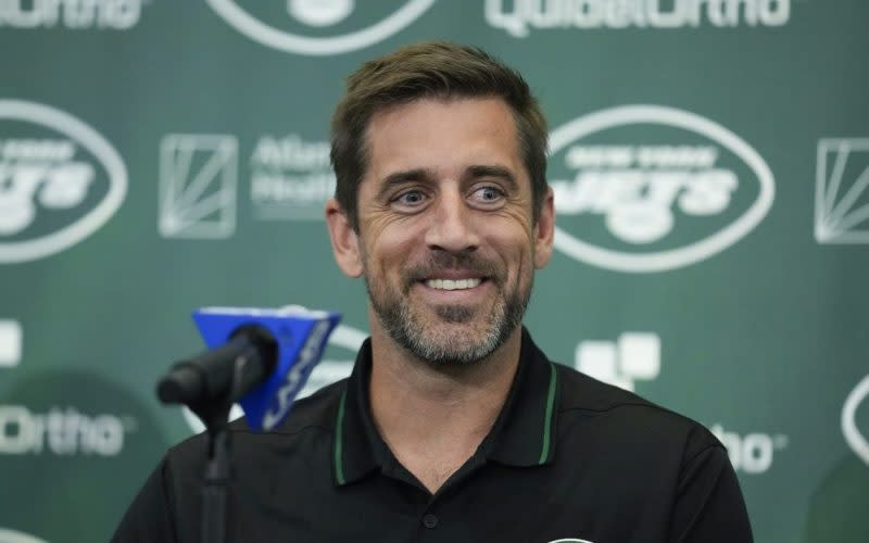 New York Jets’ quarterback Aaron Rodgers smiles during an NFL football news conference at the Jets’ training facility in Florham Park, N.J., on April 26, 2023. (AP Photo/Seth Wenig)