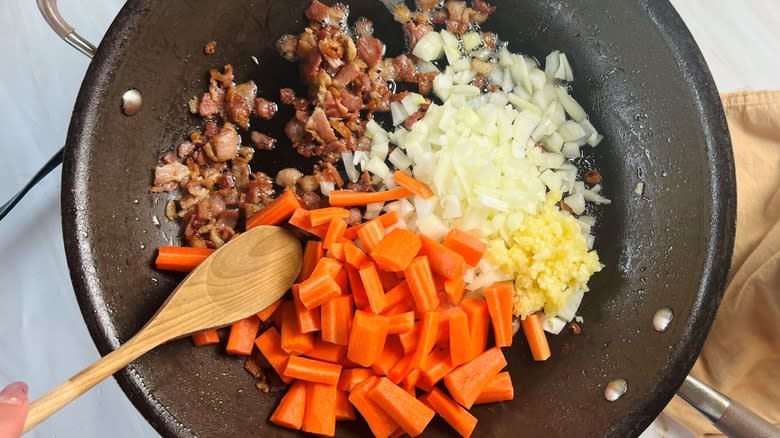 vegetables and bacon in pan