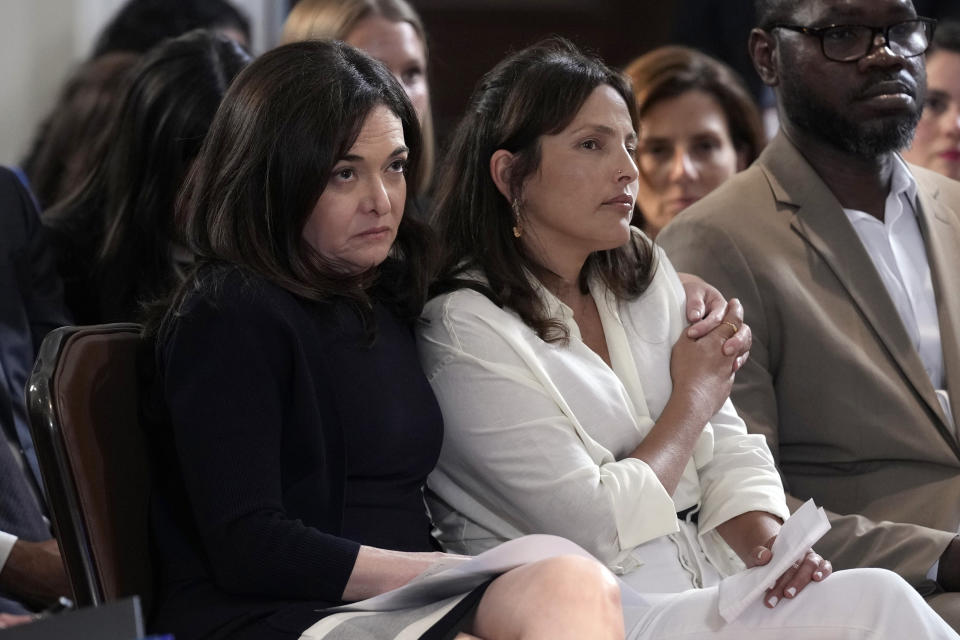 Sheryl Sandberg, former COO of Meta, and the presenter-led documentary film "Screams Before Silence," left, has her arm around Amit Soussana, center, as they listen to Vice President Kamala Harris speak before a screening of the film in the Eisenhower Executive Office Building on the White House complex in Washington, Monday, June 17, 2024. The film is a documentary about the rape and mutilation of Israeli women on Oct. 7 and includes an interview with Soussana. (AP Photo/Susan Walsh)