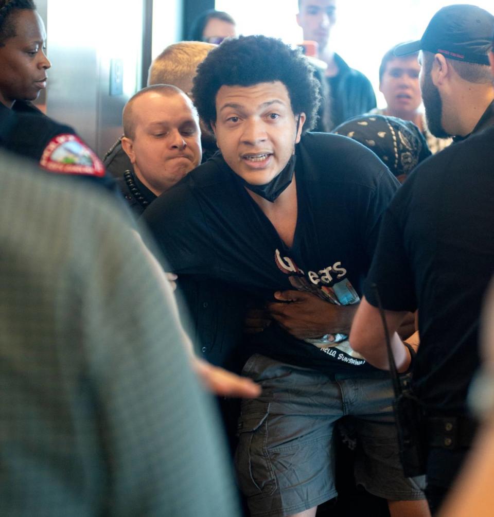 Protesters tangle with police on the ninth floor of The Dillon in Raleigh, N.C., Thursday, May 23, 2024. The protesters were demonstrating against the UNC Board of Governors DEI vote.