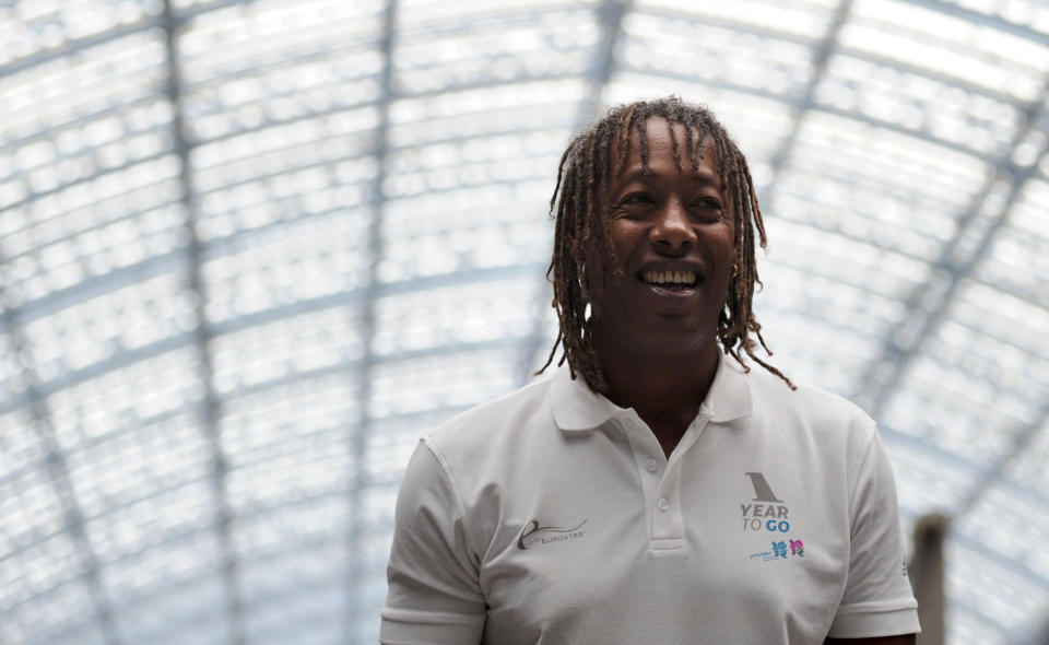 Former France Handball player, Jackson Richardson, arrives at St Pancras International Station in central London, on July 27, 2011. The one-year countdown to the 2012 Olympics got under way on Wednesday with officials bullishly predicting London was on course to deliver the best ever games with 12 months to go. International Olympic Committee chief Jacques Rogge was set to extend a formal invitation to the world's athletes during a 7:00pm ceremony at Trafalgar Square in the culmination of day-long events to mark the one-year milestone. AFP PHOTO / CARL COURT (Photo credit should read CARL COURT/AFP/Getty Images)