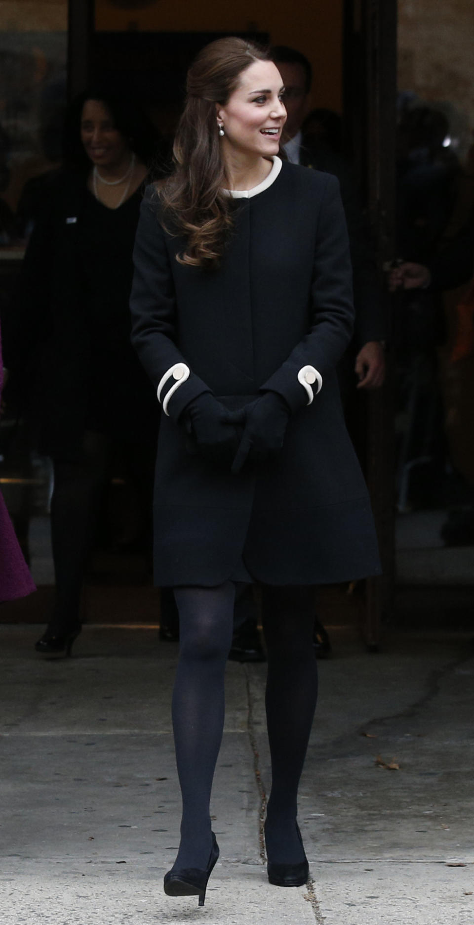 <p>For a day of engagements in New York, Kate chose a stylish black coat from Goat, coordinating shoes by Episode and a black Mulberry clutch. </p><p><i>[Photo: PA]</i></p>