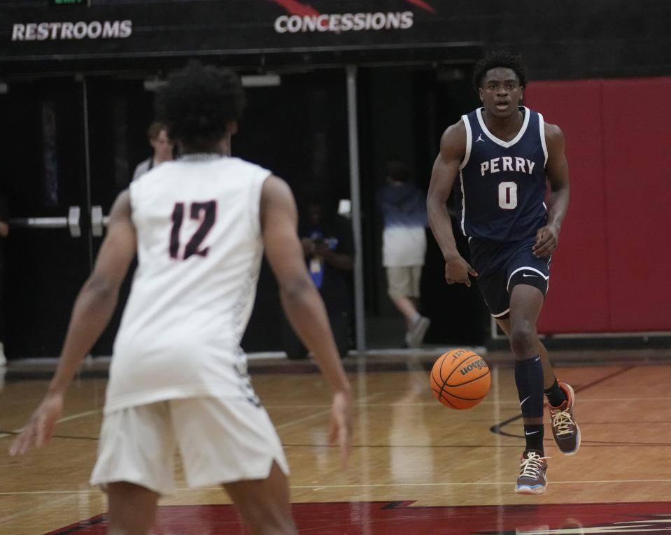 Perry guard Ben Egbo (0) brings the ball up against Liberty at Liberty High School gym in Peoria, Ariz., on Nov. 29, 2022.