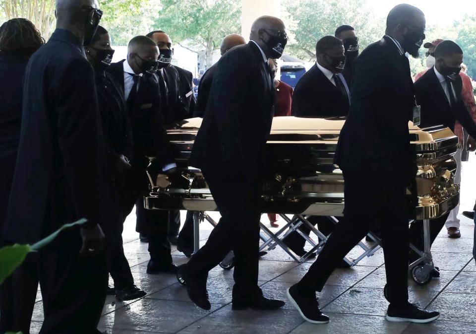 <div class="inline-image__caption"><p>Pallbearers brought the casket bearing the remains of George Floyd into the Fountain of Praise church for his memorial and funeral services on June 8, 2020 in Houston, Texas. Floyd died May 25 while in Minneapolis police custody, sparking nationwide protests. A white police officer, Derek Chauvin, has been charged with second-degree murder, with the three other officers involved facing other charges.</p></div> <div class="inline-image__credit">Mario Tama/Getty</div>