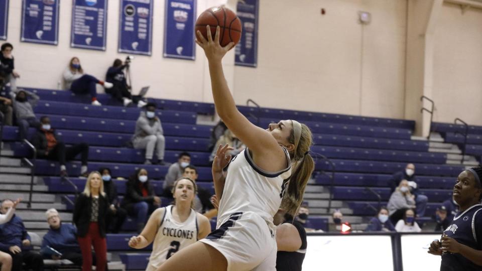 McKayla Mooney driving to the basket for a layup shot for the Centenary Cyclones.