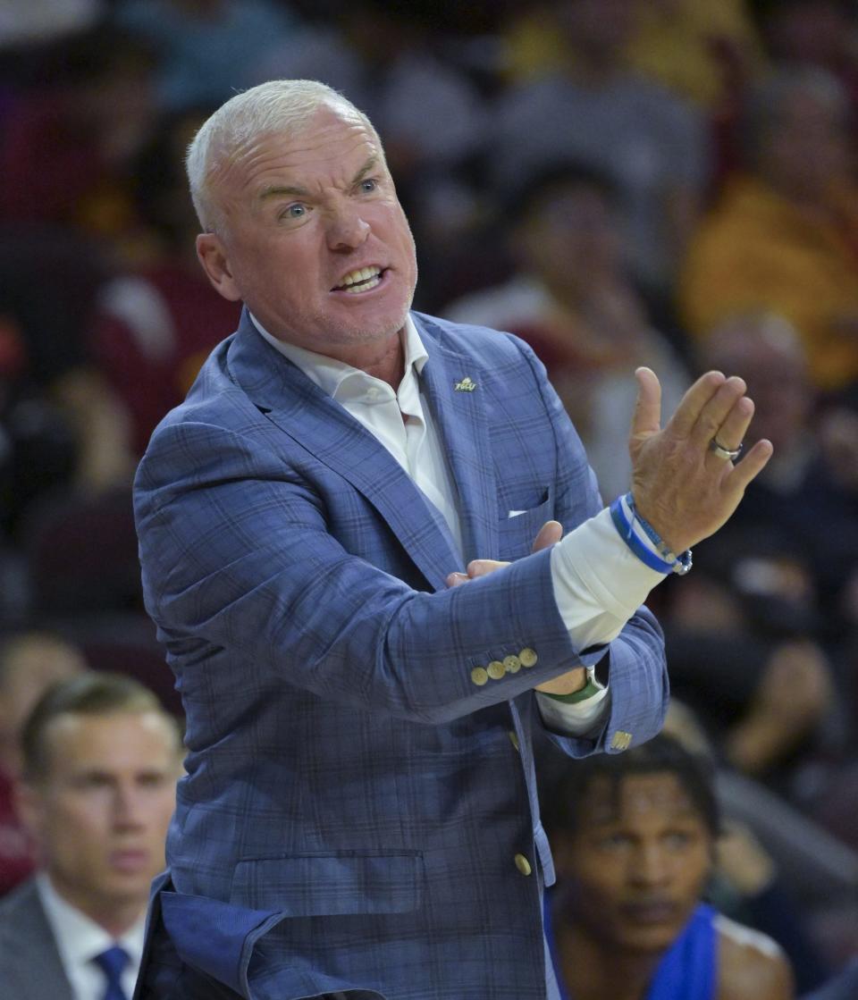 Florida Gulf Coast Eagles head coach Pat Chambers yells from the bench in the first half against the USC Trojans at Galen Center.